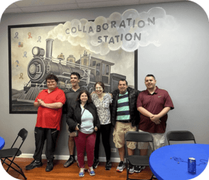 A group of people standing in front of a train.